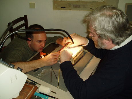 Prof Nicholas Pickwoad and Andrew Honey working on MS Greek 418