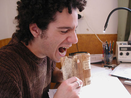 Nikolas Sarris pretending to eat a book
