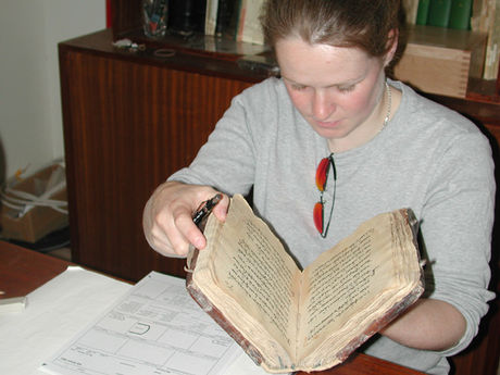 Nicole Gilroy examining a book