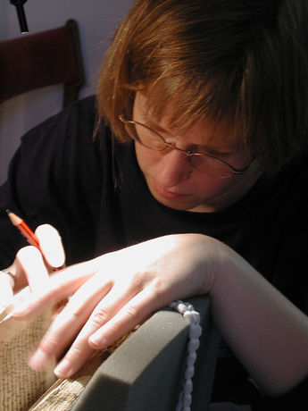 Caroline Scharfenberg examining a book