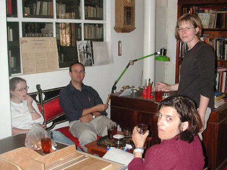 Members of the team drinking tea in the library